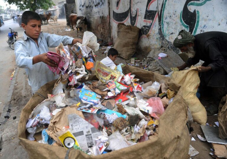 Among Peshawar’s waste, Afghan refugees confront the hidden dangers of medical trash